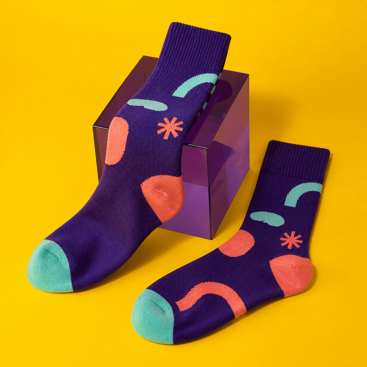 Colorful custom brand socks photographed on a bright studio set